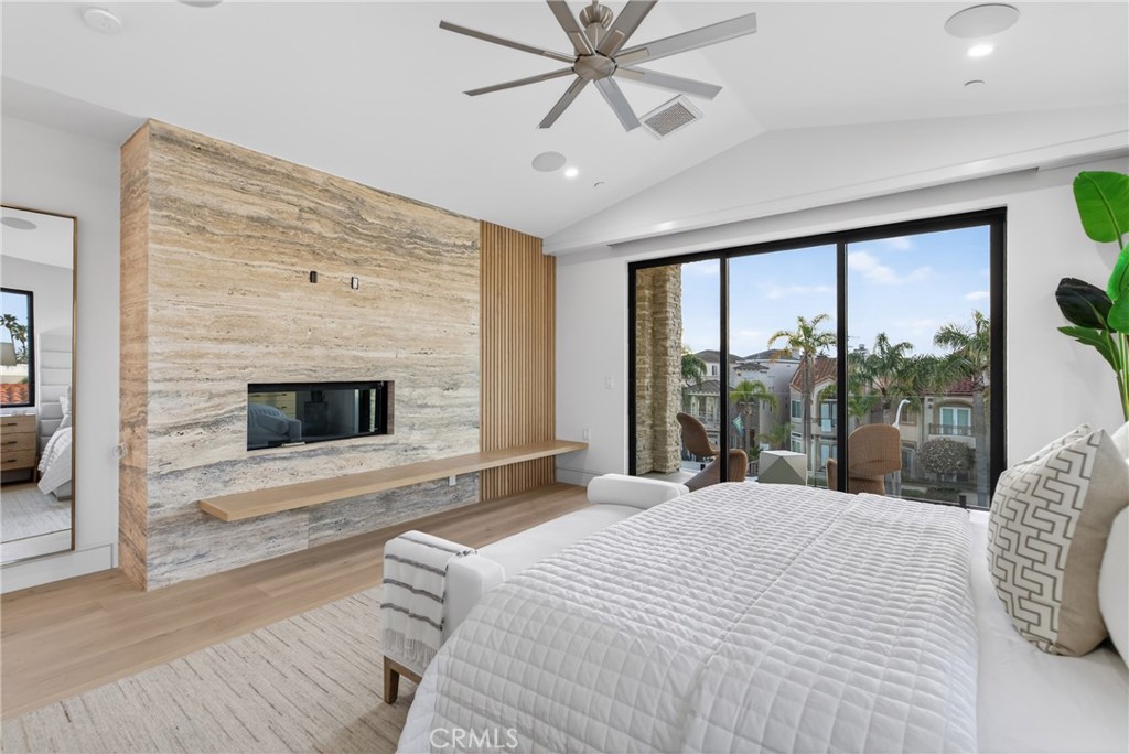 520 11th Street Huntington Beach, CA 92648 - Photo 34 of 65 a bedroom with a large bed and a large window