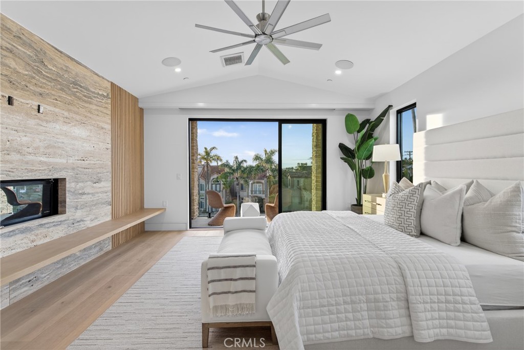 520 11th Street Huntington Beach, CA 92648 - Photo 36 of 65 a bedroom with a bed and a large window with balcony view