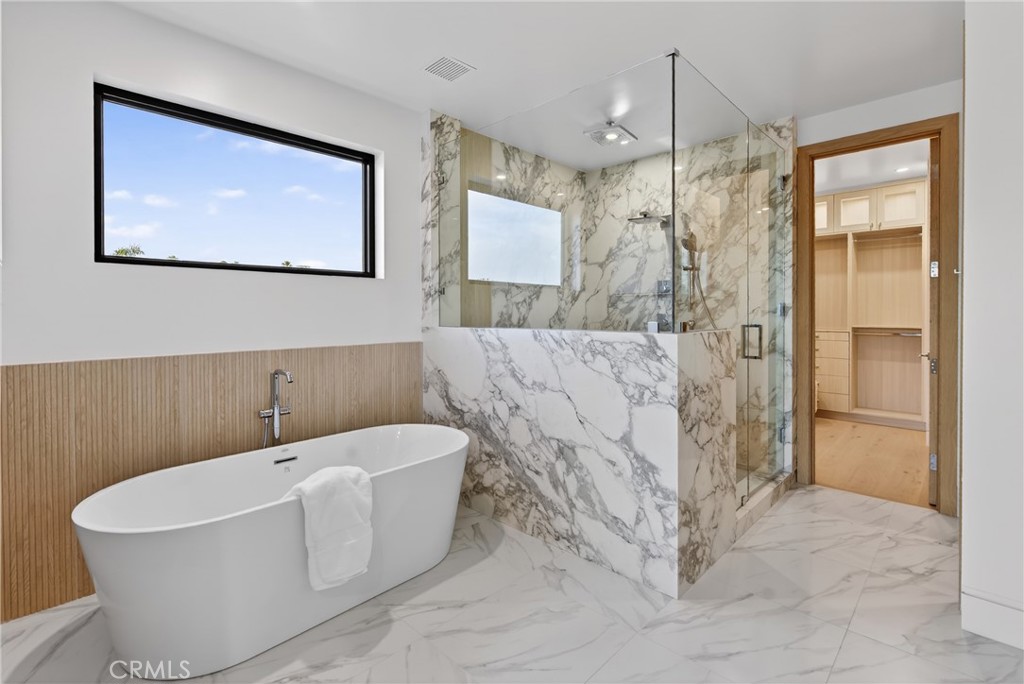 520 11th Street Huntington Beach, CA 92648 - Photo 40 of 65 a bathroom with a bathtub and a shower