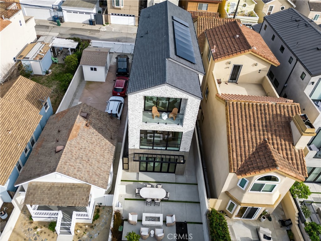 520 11th Street Huntington Beach, CA 92648 - Photo 47 of 65 an aerial view of residential houses with outdoor space