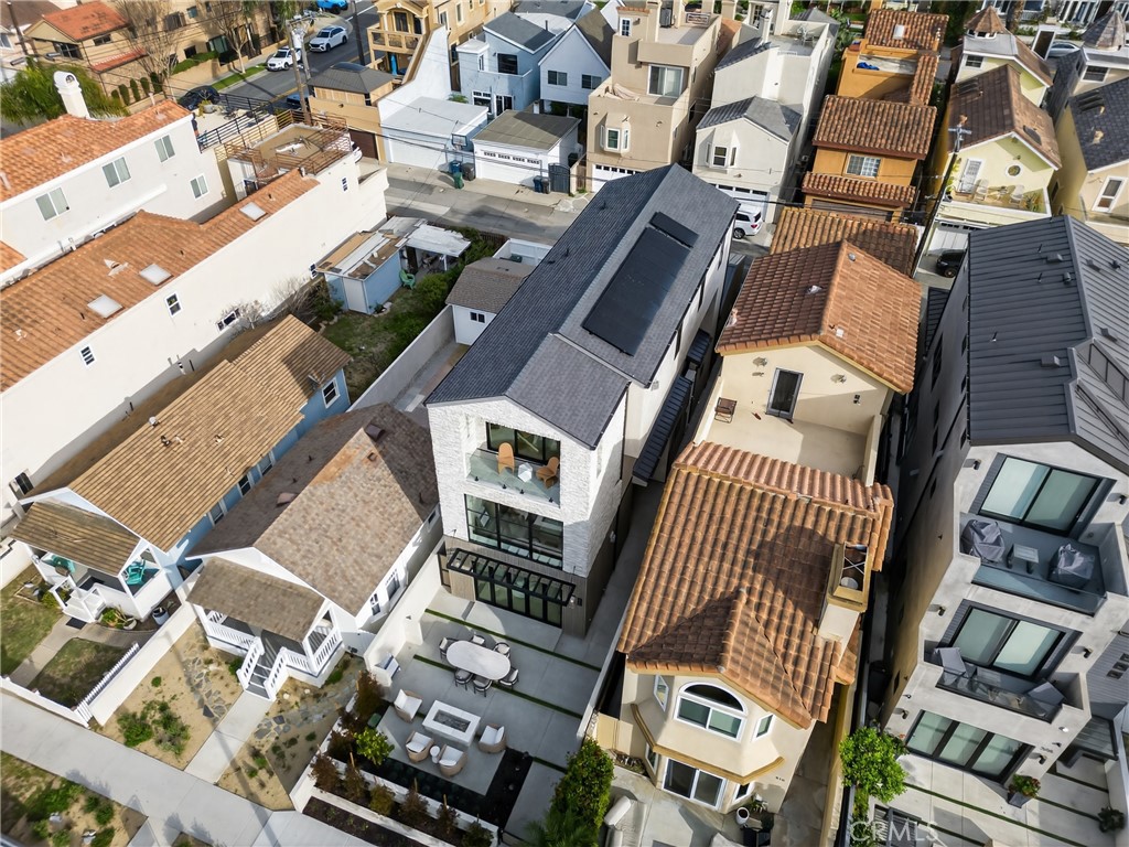 520 11th Street Huntington Beach, CA 92648 - Photo 52 of 65 an aerial view of a building with parking
