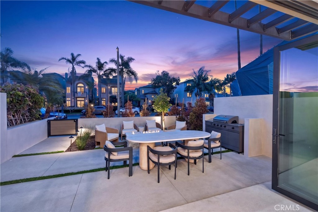520 11th Street Huntington Beach, CA 92648 - Photo 64 of 65 a view of a patio with dining table and chairs