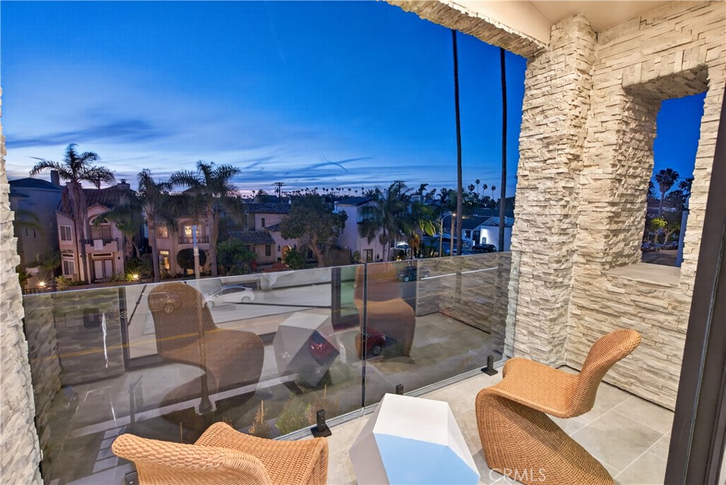 520 11th Street Huntington Beach, CA 92648 - Photo 65 of 65 a view of a balcony with furniture and a potted plant