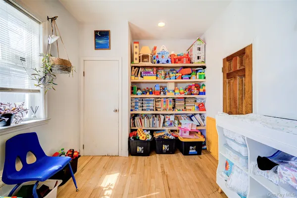 a bed room with a bed and a book shelf