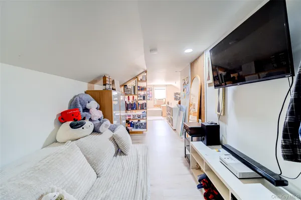 a living room with lots of furniture and wooden floor
