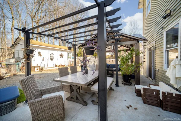 a view of a livingroom with furniture and a window
