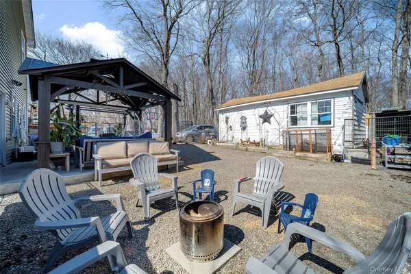 a view of a patio with fire pit