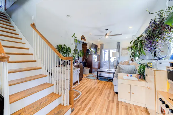 a view of a living room and entryway
