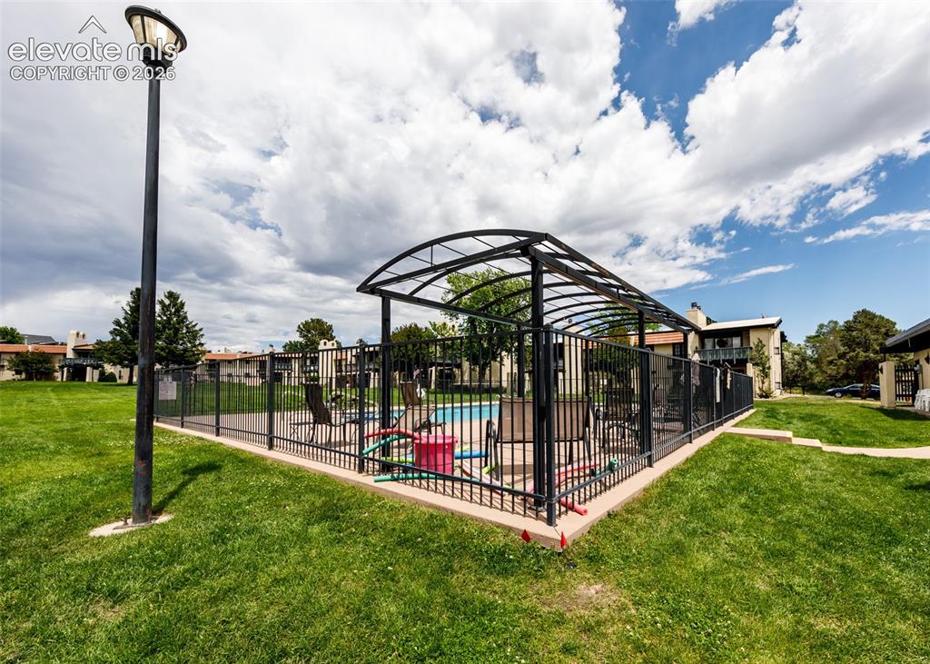 1034 Fontmore Road, Unit D Colorado Springs, CO 80904 - Photo 38 of 43 a view of a park with iron fence