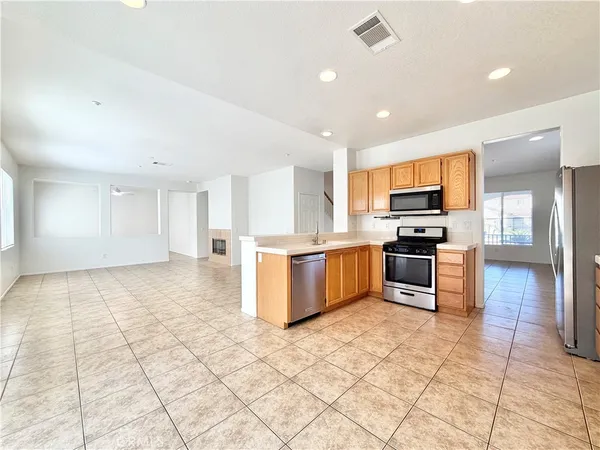 a kitchen with stainless steel appliances cabinets