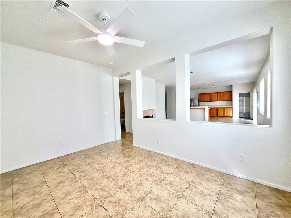 8182 Bon View Drive Riverside, CA 92508 - Photo 17 of 43 wooden floor in an empty room with a window