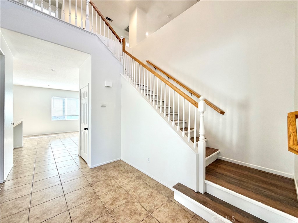 8182 Bon View Drive Riverside, CA 92508 - Photo 21 of 43 a view of entryway and hall with wooden floor
