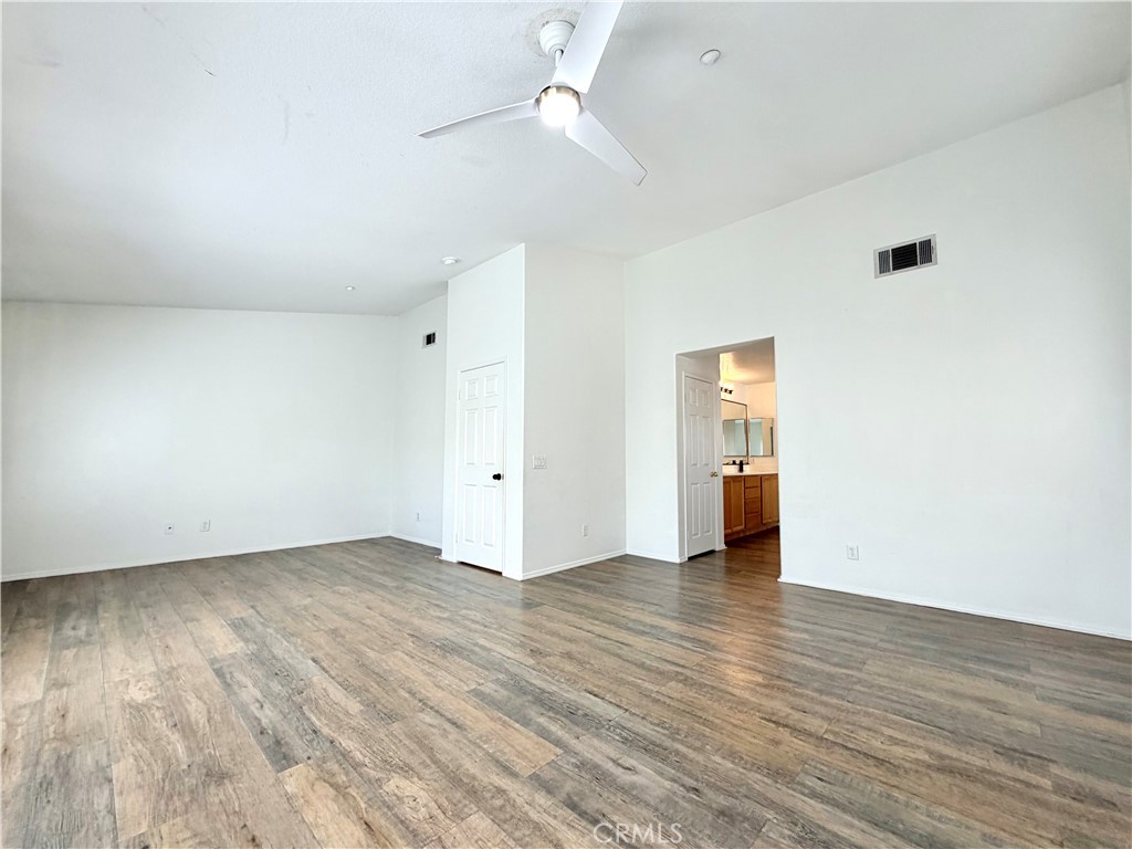8182 Bon View Drive Riverside, CA 92508 - Photo 31 of 43 a view of an empty room with wooden floor