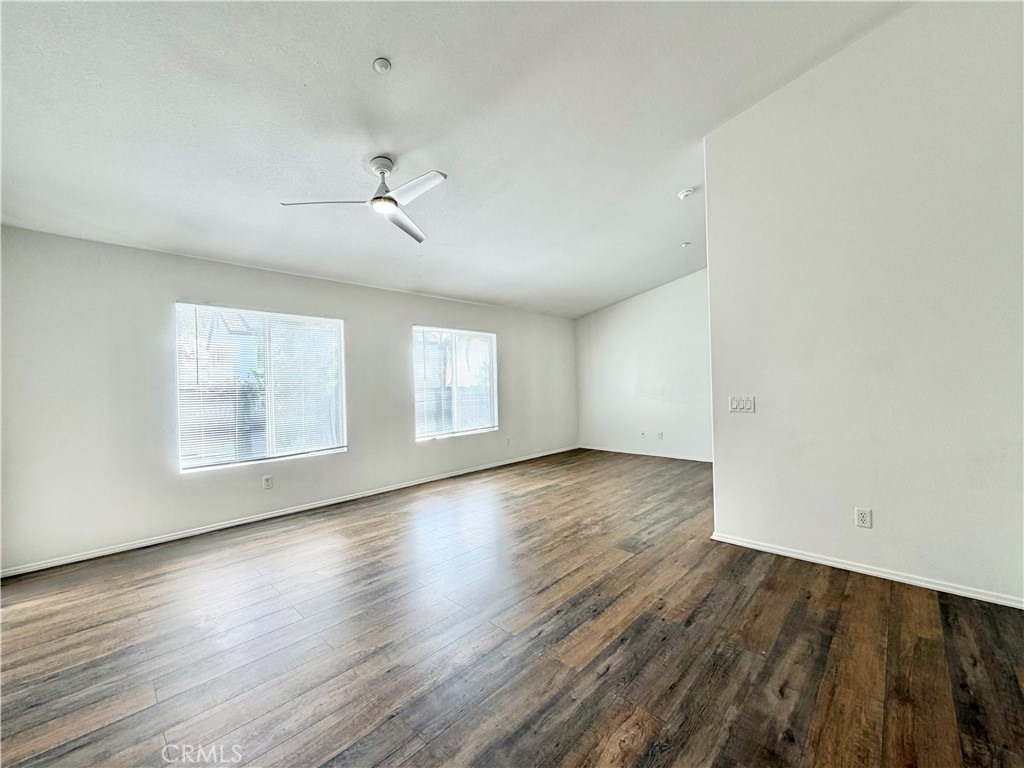 8182 Bon View Drive Riverside, CA 92508 - Photo 32 of 43 wooden floor in an empty room with a window