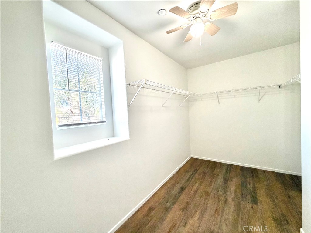 8182 Bon View Drive Riverside, CA 92508 - Photo 37 of 43 a view of a room with wooden floor and fan