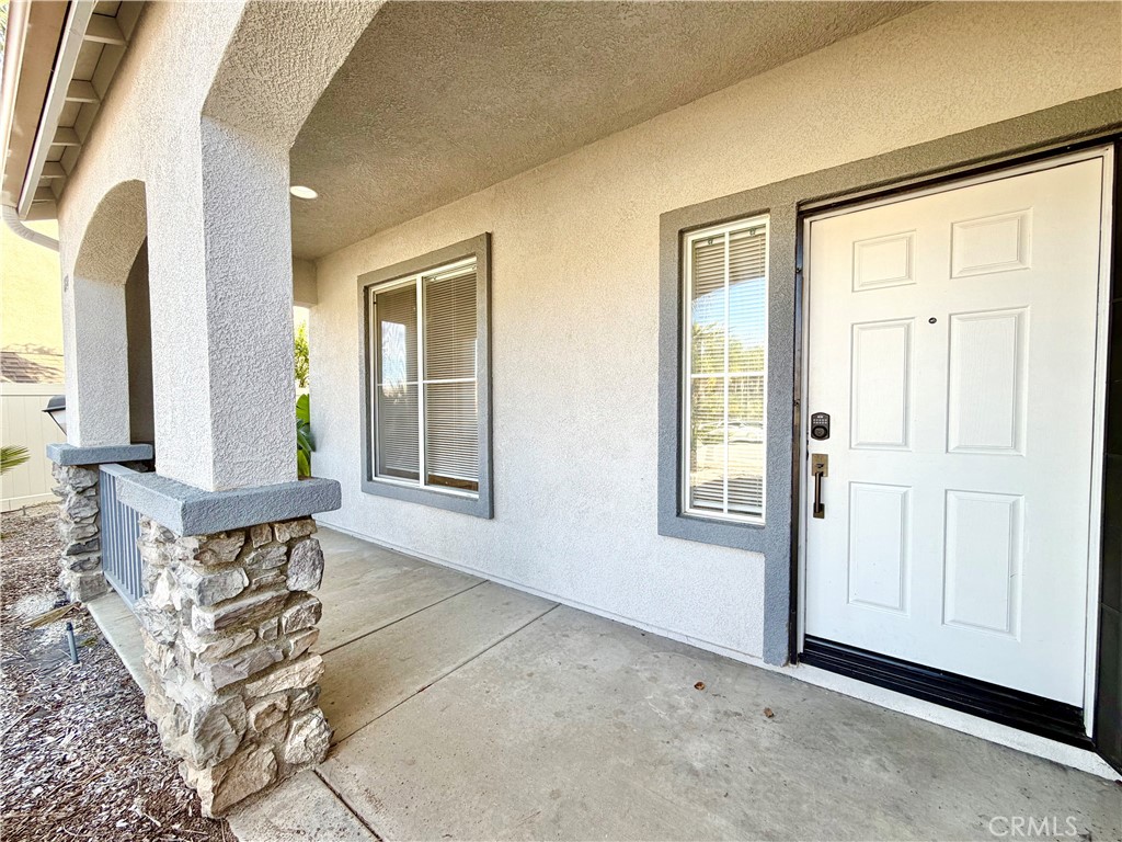 8182 Bon View Drive Riverside, CA 92508 - Photo 5 of 43 a view of front door with furniture and a window