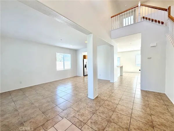 a view of a big room with closet and windows