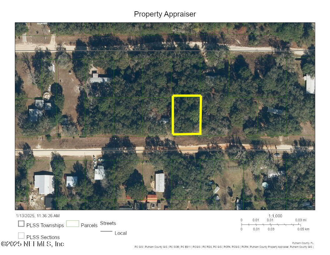 a aerial view of a house with a yard