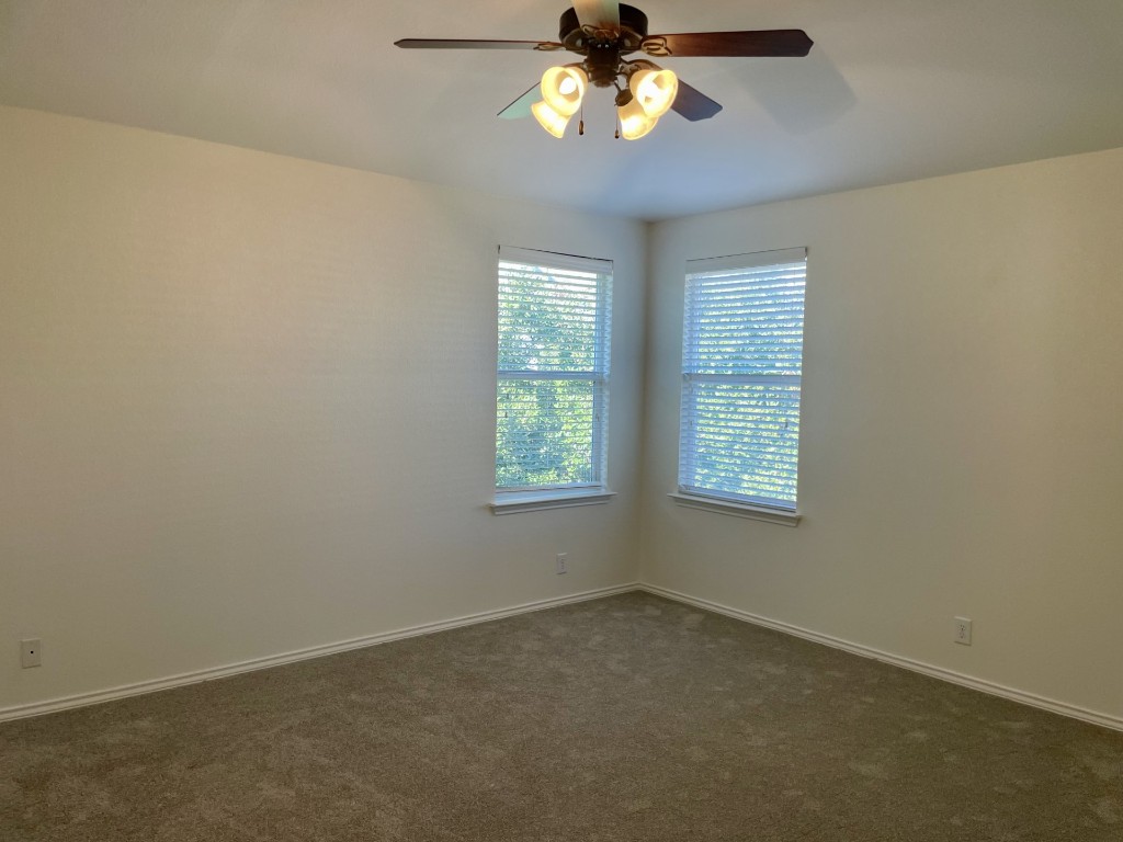 8725 White Ibis Drive Austin, TX 78729 - Photo 16 of 29 an empty room with a window