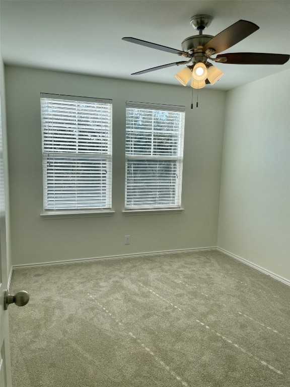 8725 White Ibis Drive Austin, TX 78729 - Photo 23 of 29 an empty room with a window
