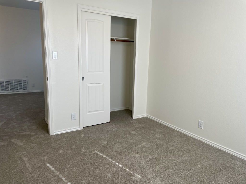 8725 White Ibis Drive Austin, TX 78729 - Photo 25 of 29 an empty room with closet area