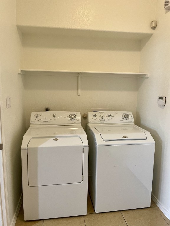 8725 White Ibis Drive Austin, TX 78729 - Photo 27 of 29 a utility room with dryer and washer