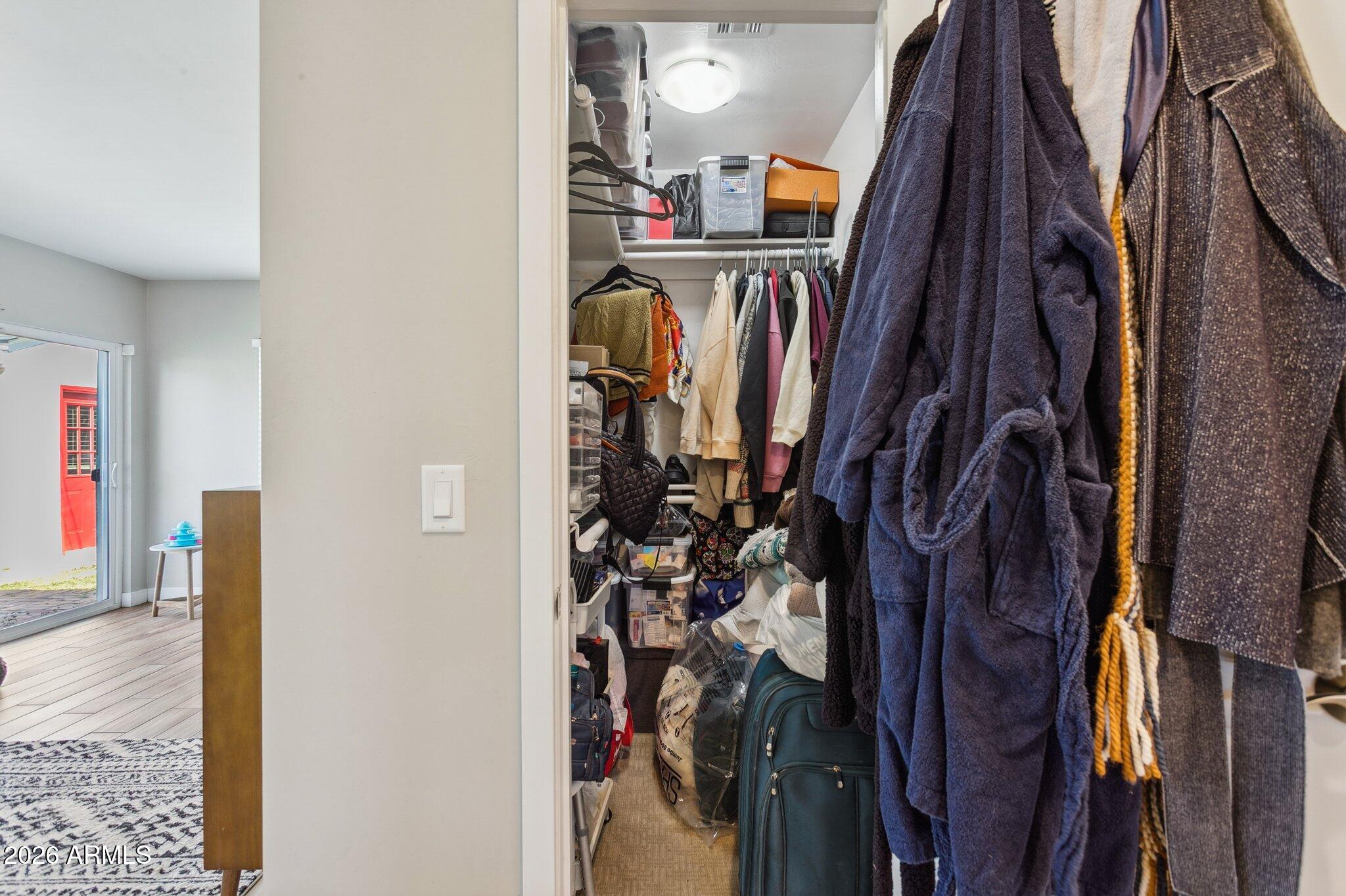 322 West Coronado Road Phoenix, AZ 85003 - Photo 62 of 93 a view of walk in closet with clothes and shoes