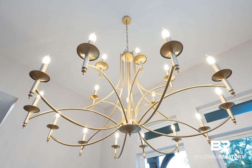 13066 Gopher Court Elberta, AL 36530 - Photo 23 of 38 Multi-arm chandelier with a gold-tone finish and candelabra-style bulbs.