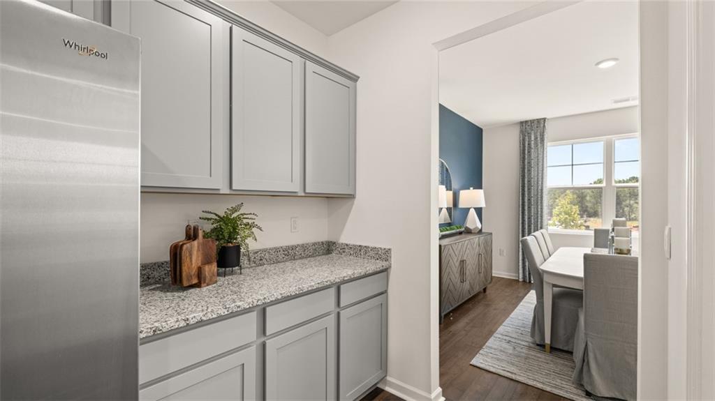 56 Weymouth Drive Locust Grove, GA 30248 - Photo 17 of 62 a kitchen with a sink cabinets and window