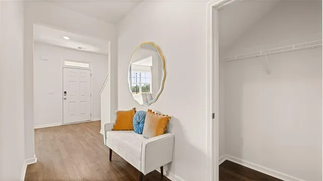 a bedroom with a bed and a potted plant