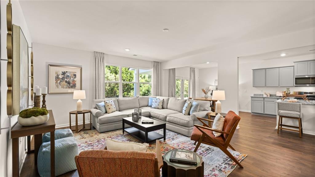 56 Weymouth Drive Locust Grove, GA 30248 - Photo 25 of 62 a living room with furniture and a large window
