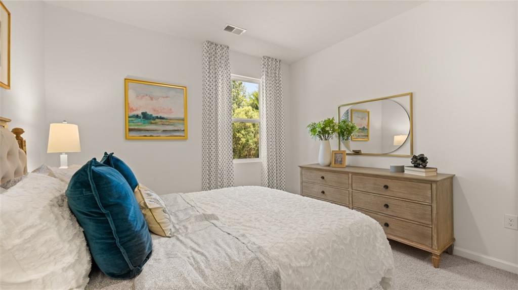 56 Weymouth Drive Locust Grove, GA 30248 - Photo 32 of 62 a bedroom with a bed and a dresser