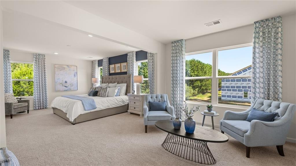 56 Weymouth Drive Locust Grove, GA 30248 - Photo 35 of 62 a spacious bedroom with furniture and a large window