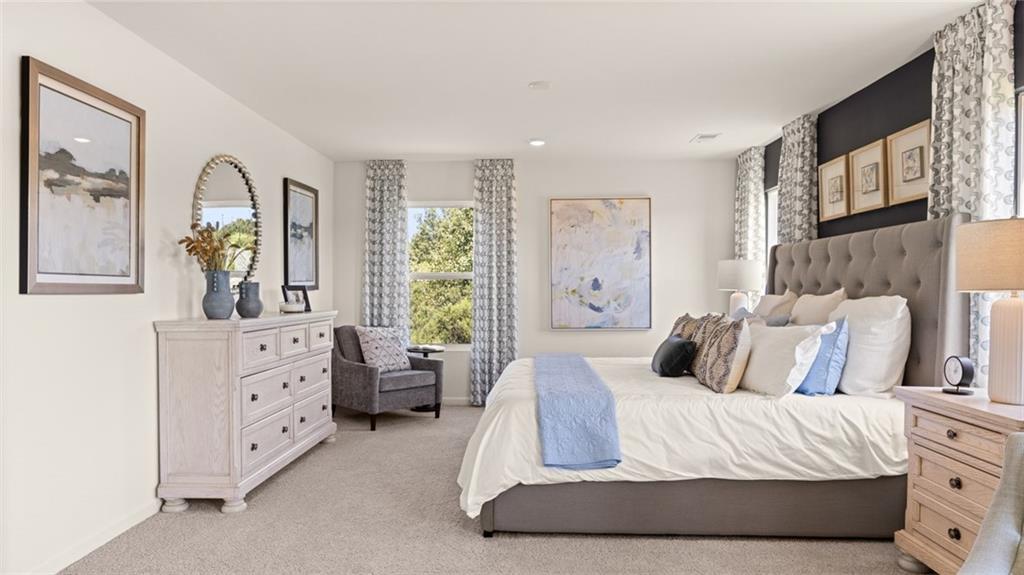 56 Weymouth Drive Locust Grove, GA 30248 - Photo 36 of 62 a bedroom with a bed and a dresser