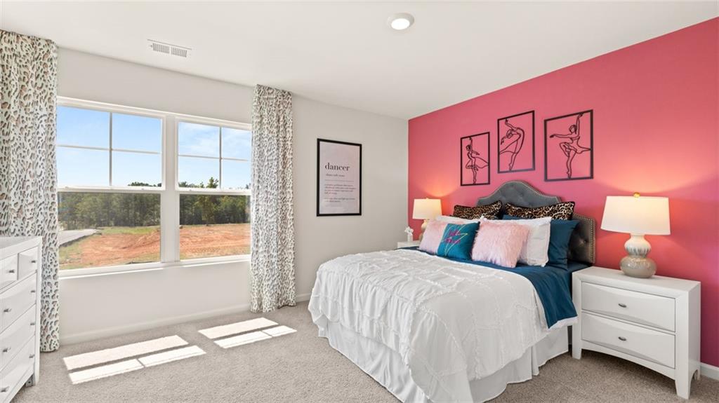 56 Weymouth Drive Locust Grove, GA 30248 - Photo 53 of 62 a bedroom with a bed and a window