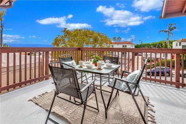 a view of a chairs and table on the terrace