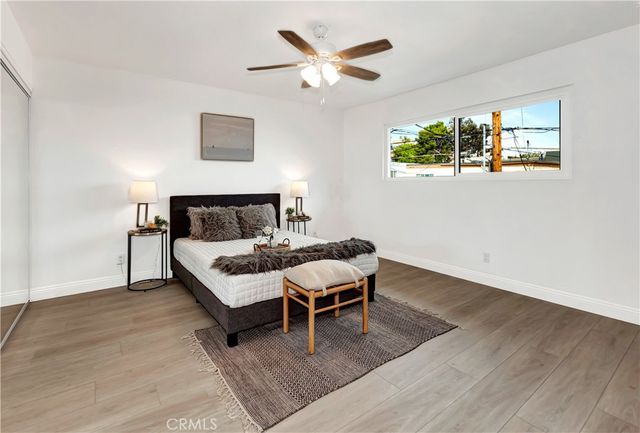 a bedroom with a bed and a table in it