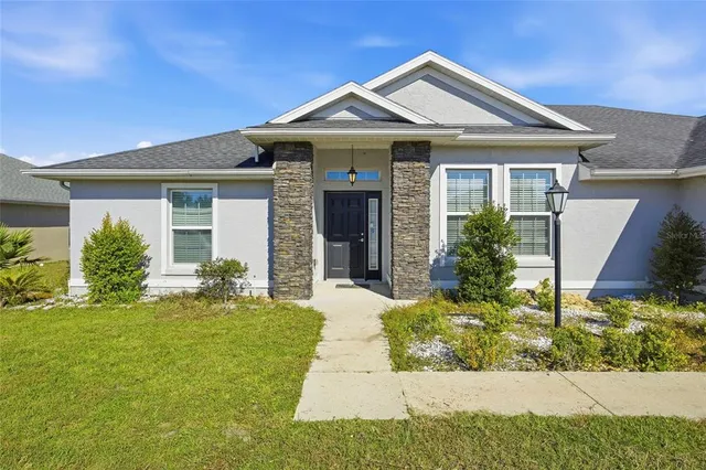 front view of a house with a yard