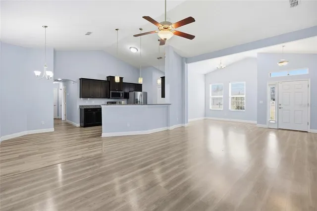 a view of a kitchen with a sink and a microwave