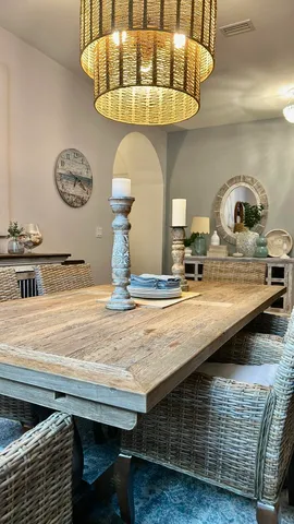 a bathroom with a table and a chandelier