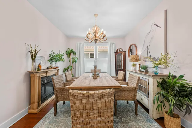 a view of a dining room with furniture window and flowerpot