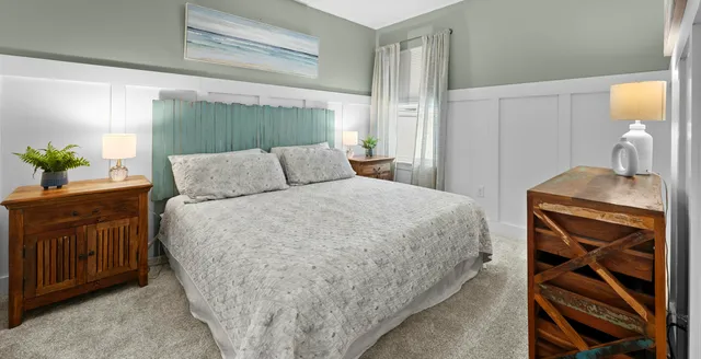 a bedroom with a bed and a dresser