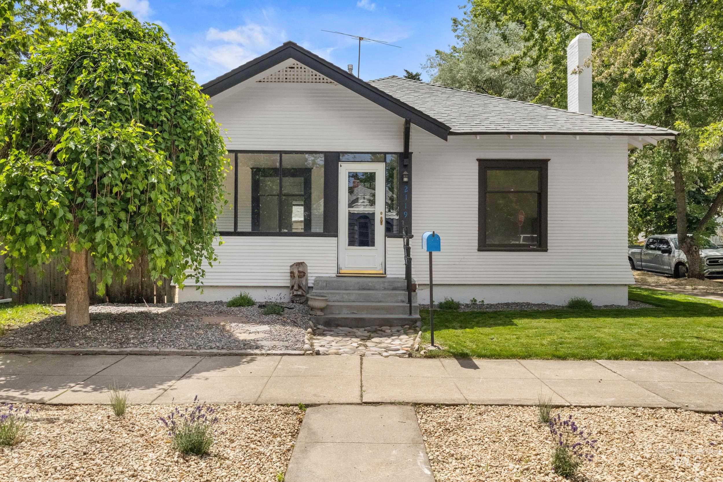 2119 West Brumback Street Boise, ID 83702 - Photo 3 of 30 White exterior with dark trim and a prominent front gable