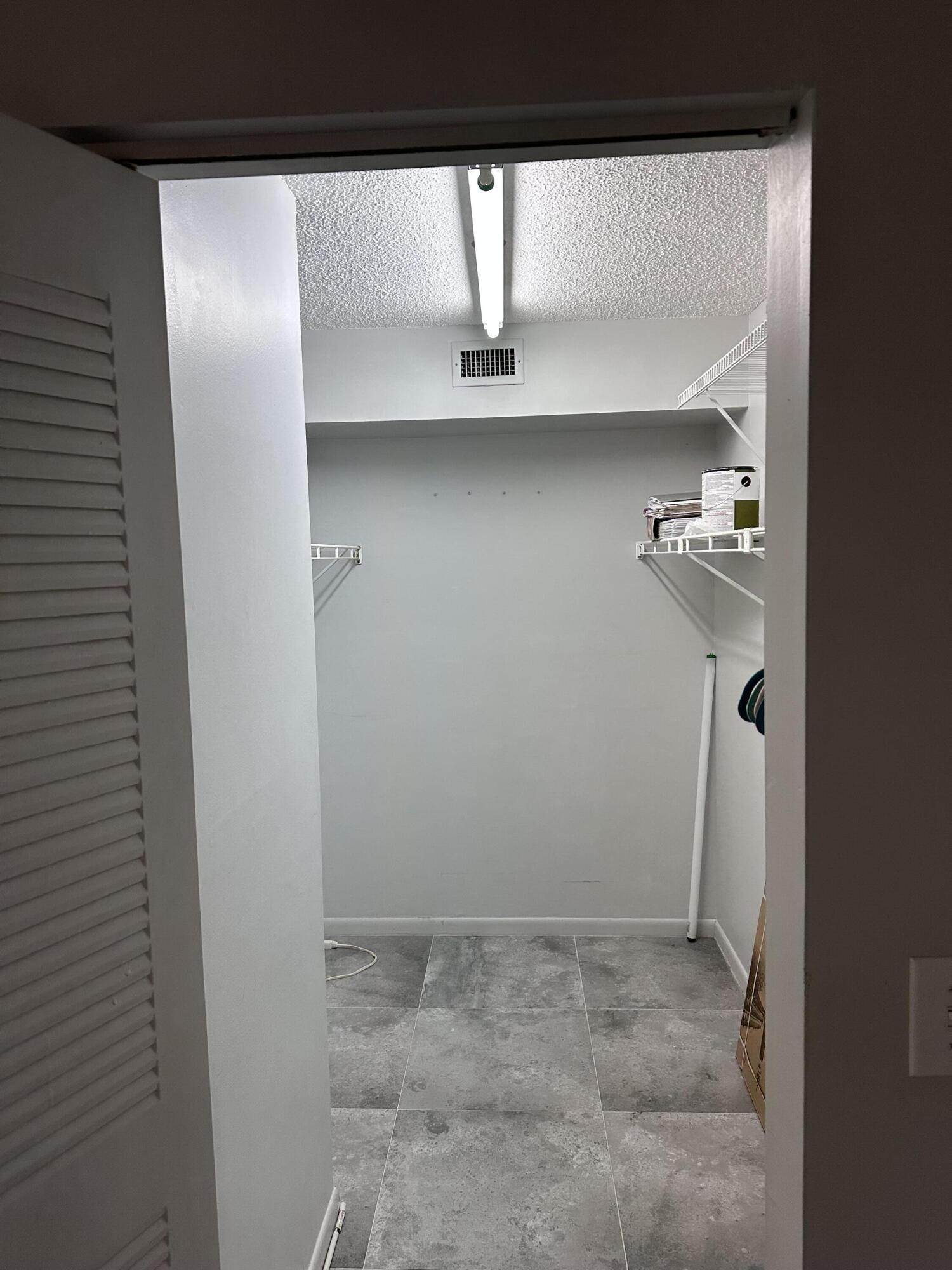 14895 Builtmore Way, Unit 107 Delray Beach, FL 33446 - Photo 12 of 29 master closet from bedroom