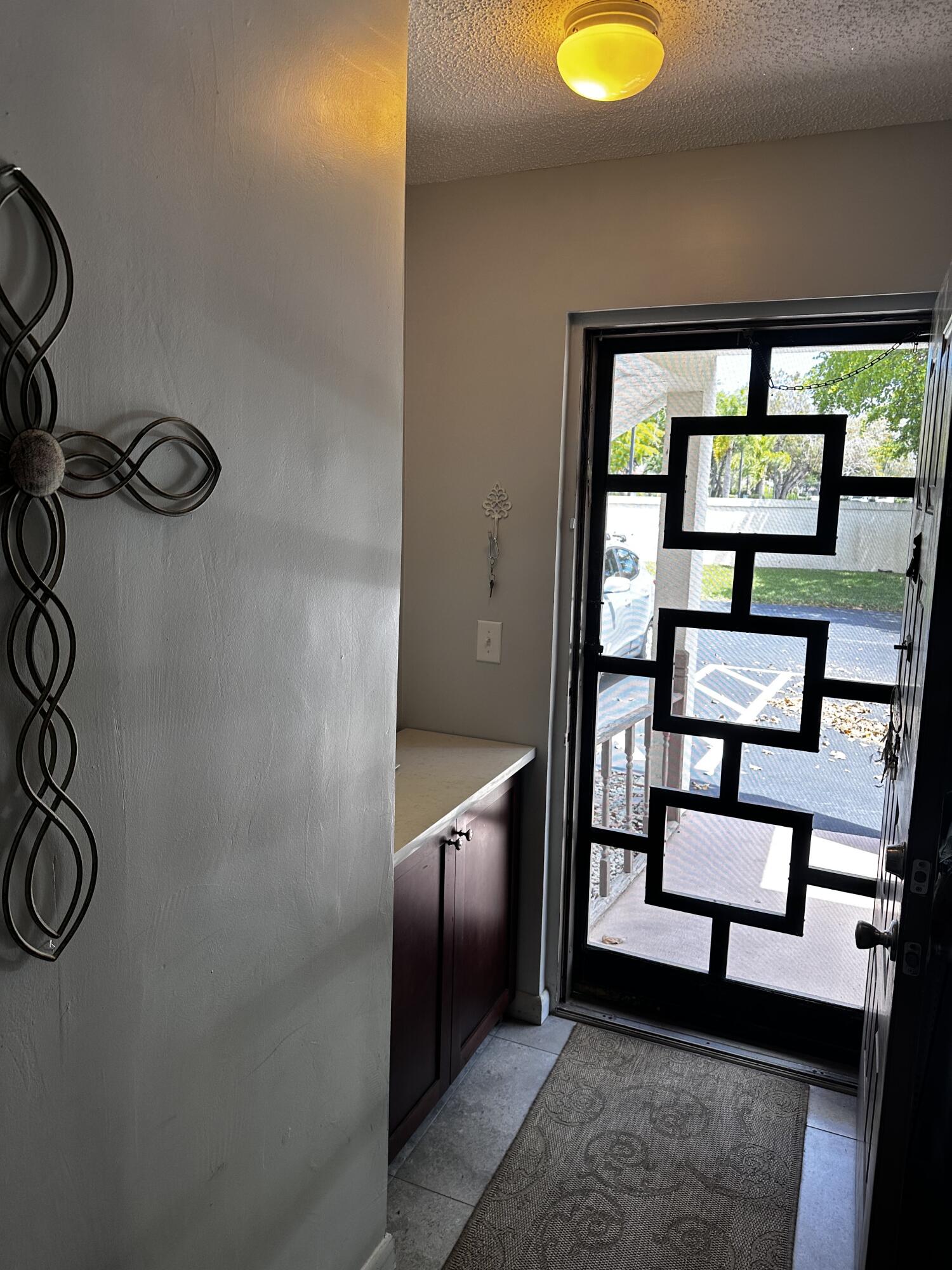 14895 Builtmore Way, Unit 107 Delray Beach, FL 33446 - Photo 15 of 29 entrance hall detail