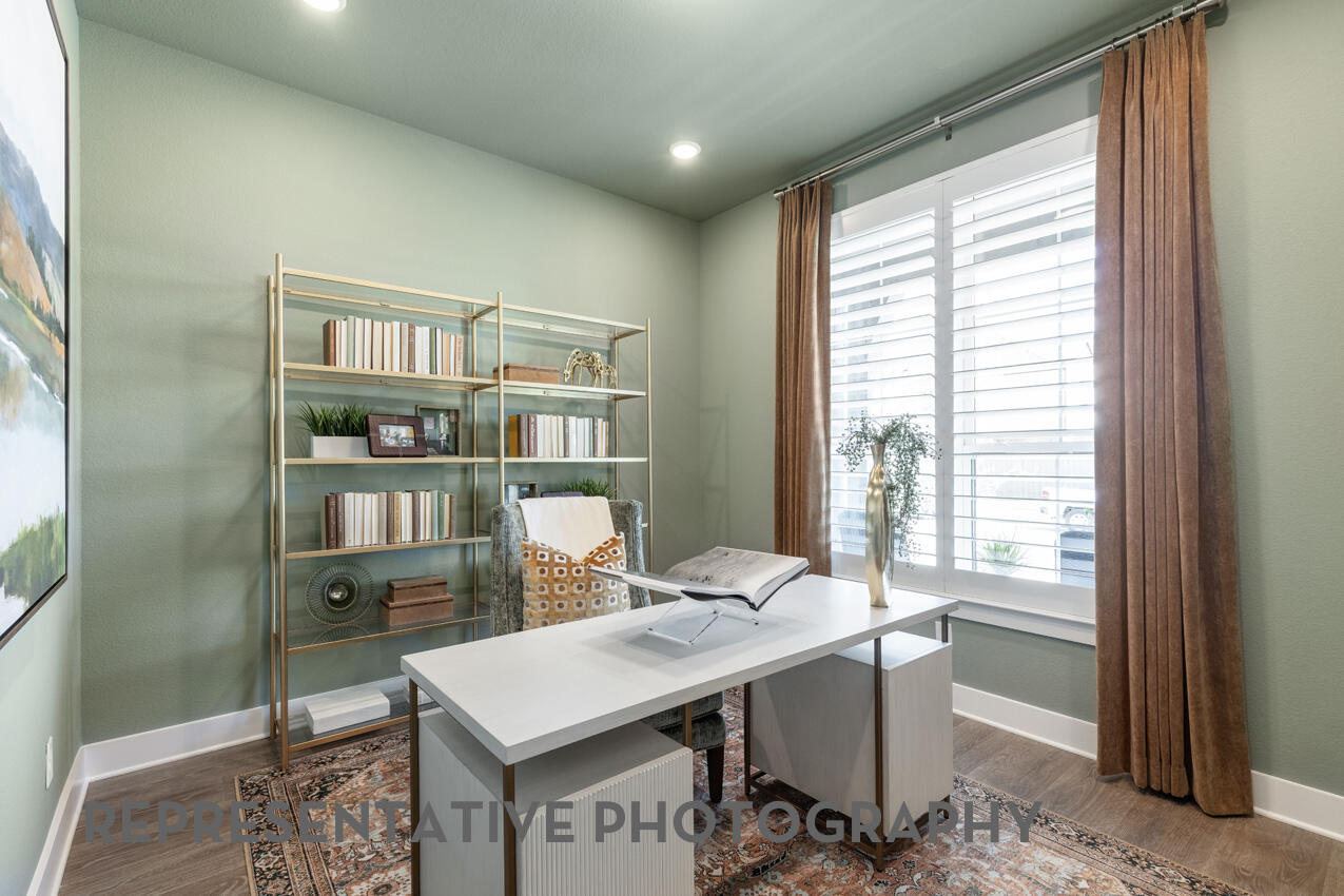 1216 Wolf Cyn Road Georgetown, TX 78628 - Photo 27 of 39 a view of a workspace with furniture and a window