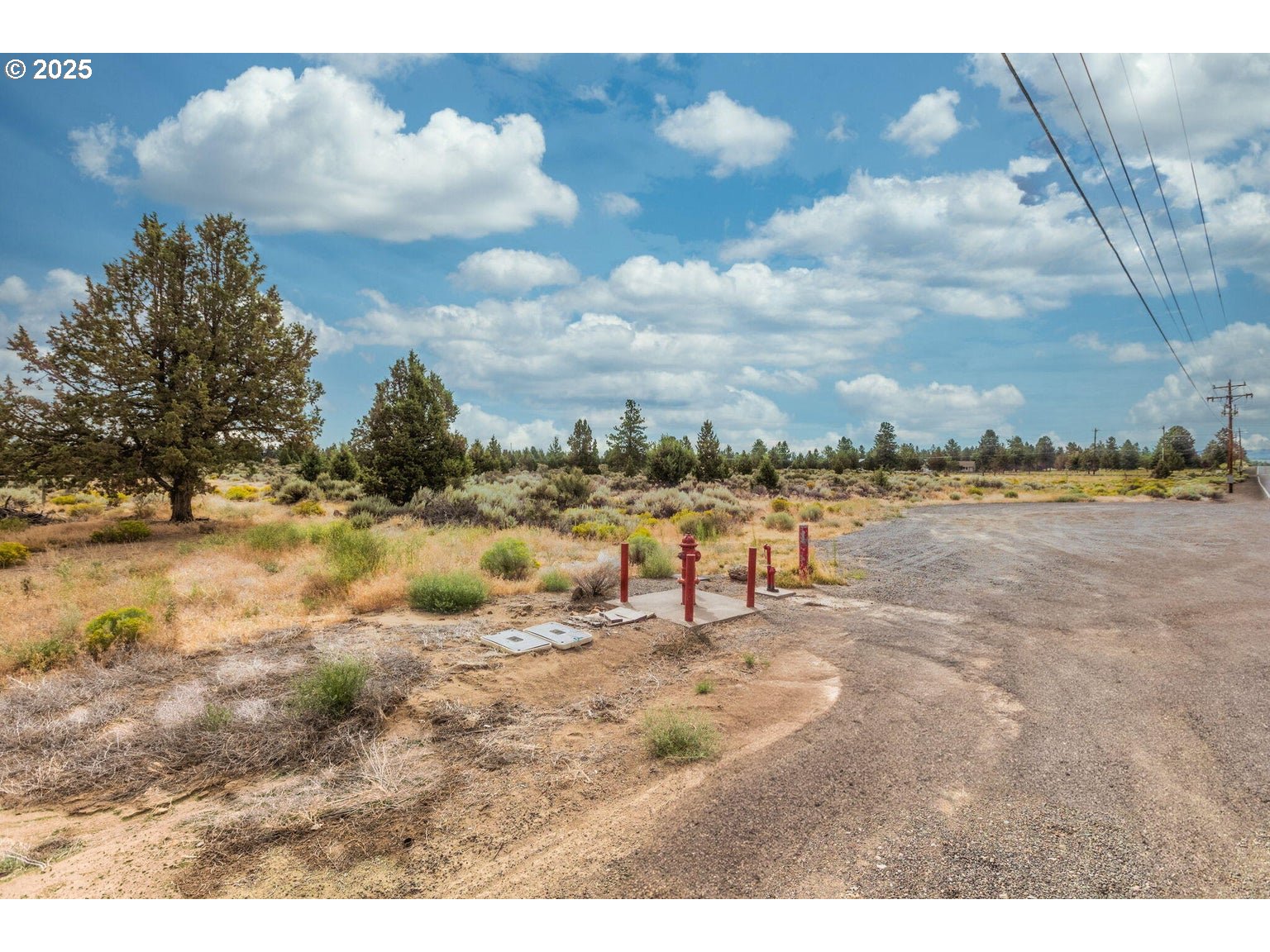 60840 Billadeau Road Bend, OR 97702 - Photo 7 of 8 a view of a lake with beach and city in the back