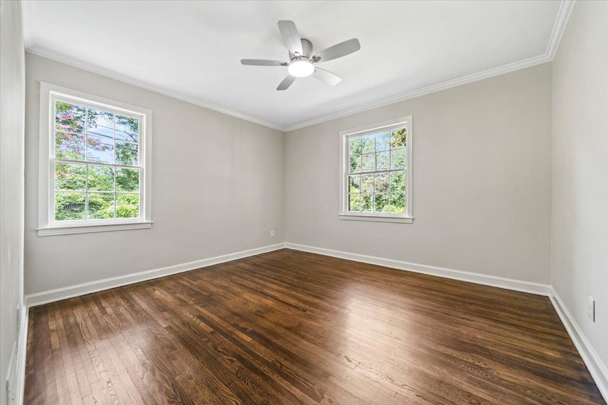 170 South Greer Street Memphis, TN 38111 - Photo 32 of 35 Hardwood flooring, painted walls, and crown molding