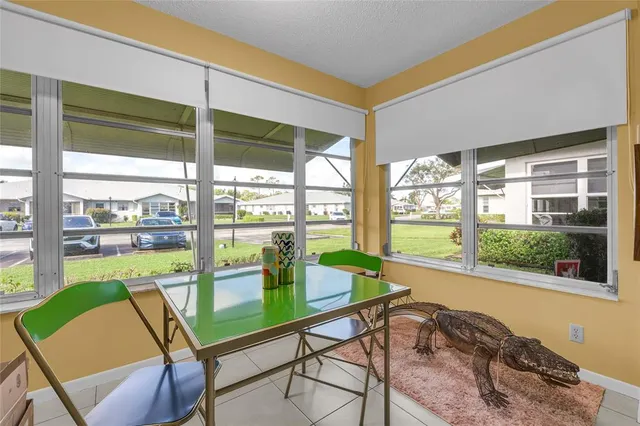 a view of a living room and floor to ceiling window or an outdoor seating