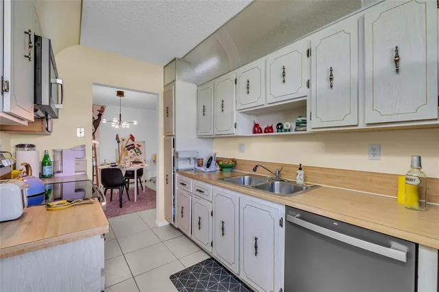 a kitchen with cabinets and window